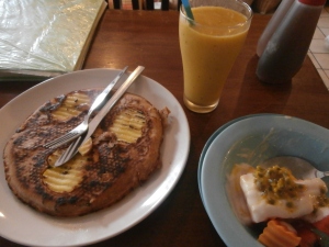 Apple and cinnamon pancakes, fruit salad with soy yoghurt and mango banana smoothie